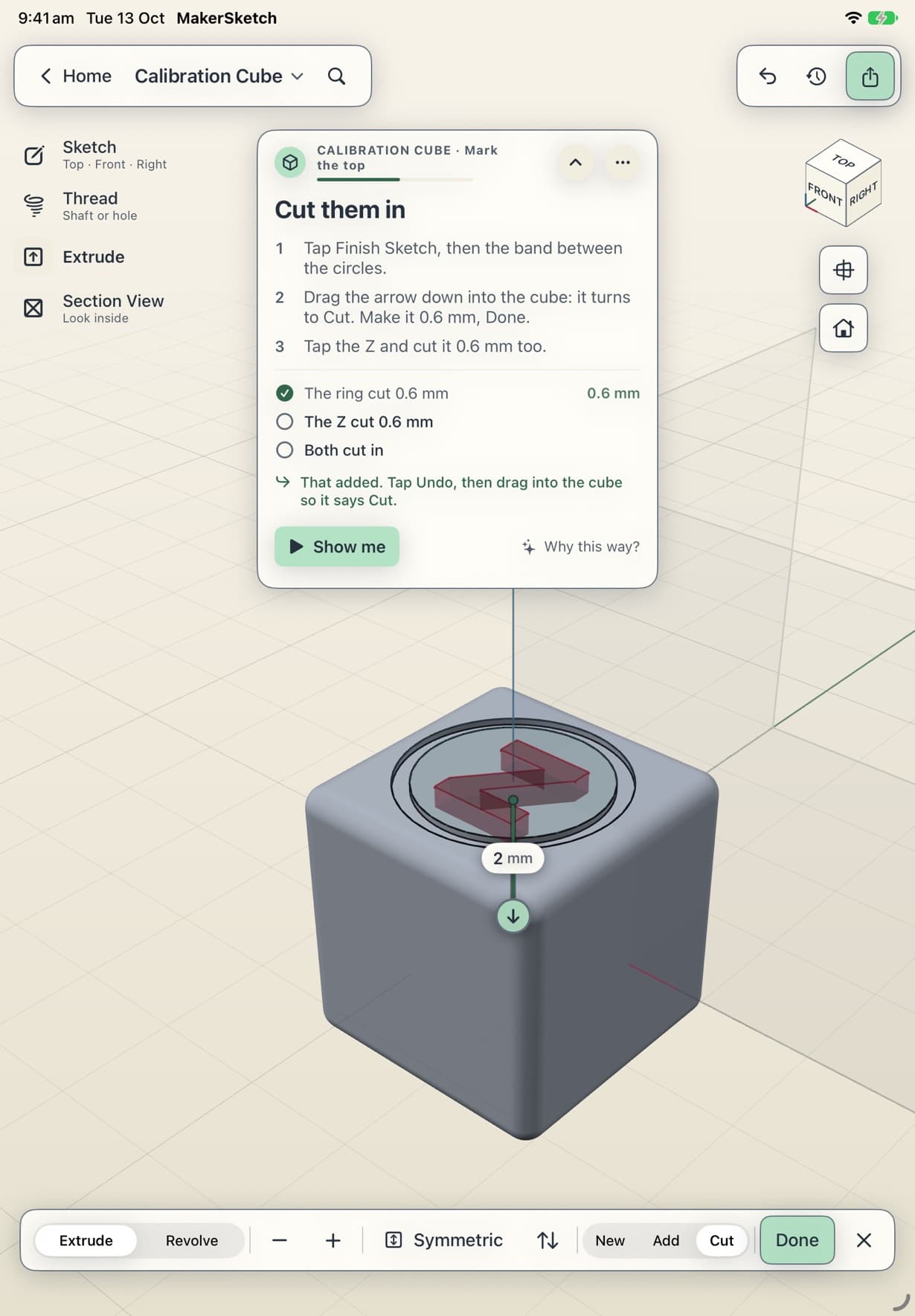 The Z previewed as a cut into the cube's top, with the ring already ticked off in the coach card.